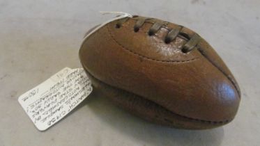 A 'Match' salesman sample of a rugby ball with autograph signatures believed to be 1930's