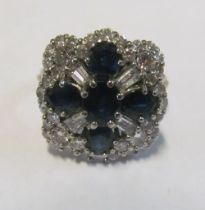 An 18ct gold sapphire and diamond ring, size S