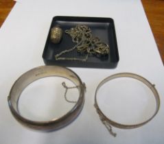 Two silver bangle bracelets and a small group of other items