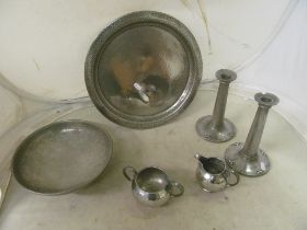 A Liberty & Co tray, three other Tudric pieces and a pair of candlesticks