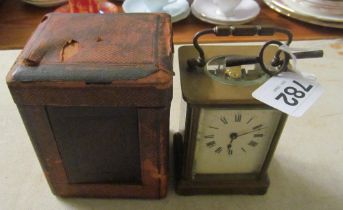 A carriage clock in case with key