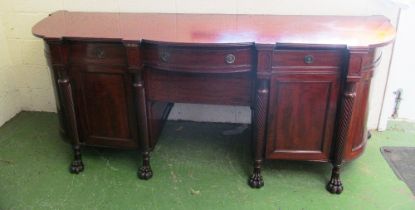 A large 19th Century mahogany sideboard with swirl legs and paw feet