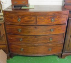 A 19th Century bow front chest of two short and three long drawers