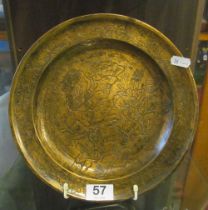 A bronze plate with oriental scene three figures