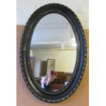 An oval black mirror