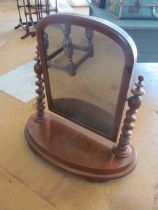 A Victorian swing mirror with barleytwist supports