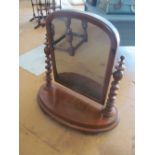A Victorian swing mirror with barleytwist supports