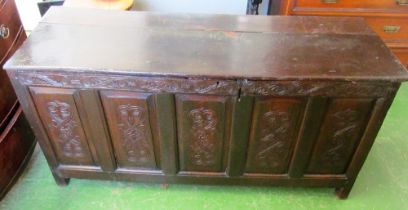 A large carved oak coffer