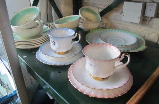 A set of six Susie Cooper 'Dresden' soup bowls and saucers and part harlequin set