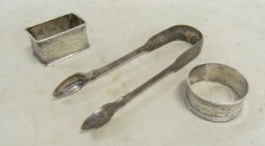 A pair of Georgian silver sugar tongs and two silver napkin rings