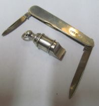A silver penknife and whistle