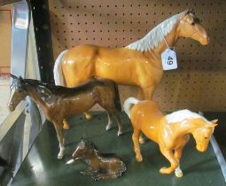 A large Beswick Palomino horse (ears a/f), and three Beswick horses