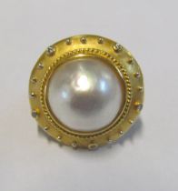 A pearl and diamond ring after Elizabeth Gagues marked 18k, size M 13g