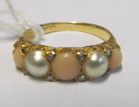 An 18ct gold coral and pearl ring