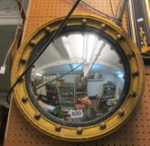 A gilt framed convex ball framed mirror