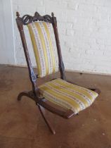 A Victorian walnut folding chair upholstered back and seat