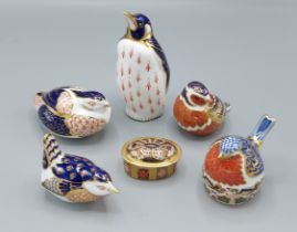 A Royal Crown Derby Emperor Penguin paperweight with gold stopper, together with four other