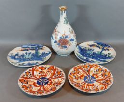 A Japanese Imari bottle neck vase together with two pairs of Japanese Imari plates