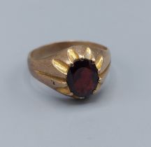 A 9ct gold signet ring set with oval Garnet, ring size T, 4.6gms