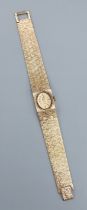 A 9ct gold cased ladies wristwatch by Accurist with 9ct gold bracelet, 34.2gms excluding movement