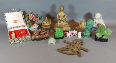 A patinated metal figure in the form of Buddha together with other related items to include