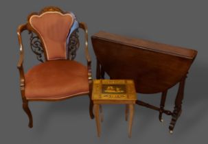An Edwardian mahogany marquetry inlaid drawing room armchair together with a Victorian Sutherland