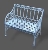 A Gothic style aluminium garden seat of pierced form, 87cms long