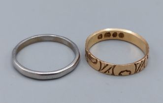 An 18ct gold wedding band, 2.1gms together with a Platinum wedding band, 2.5gms