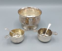 A pair of Victorian silver salts, each with pierced handles and matching spoons, London 1898,