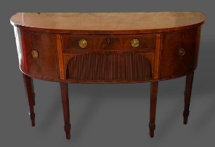 A Regency Mahogany Demi-Lune Sideboard, the line inlaid top above a central drawer and tambour