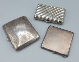 A Chester silver compact together with a Birmingham silver cigarette case and another cigarette case