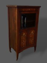 An Edwardian Rosewood and marquetry inlaid music cabinet with a partly glazed door enclosing shelves