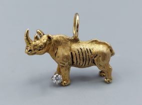 An 18ct gold pendant in the form of a Rhinoceros set with a solitaire Diamond, 13.8gms