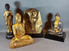 A gilded wooden figure in the form of Buddha together with two other similar figures and an Egyptian