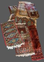 A pair of North West Persian woollen runners, with all over design, 59cms by 112cms, together with