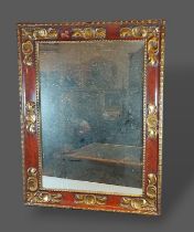 A rectangular wall mirror with carved and painted frame, 78cms x 60cms