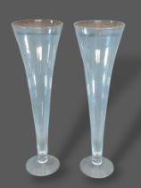 A pair of large glass spill vases of tapering form, 80cms tall