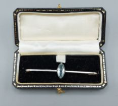 A 15ct gold bar brooch set with a Marquise Aquamarine