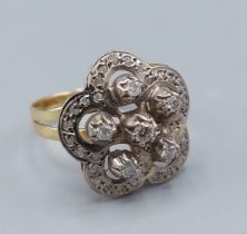 A 14ct gold Diamond cluster ring of pierced form, 4.6gms, ring size R