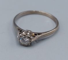 An 18ct white gold solitaire Diamond ring, 2.4gms, ring size R