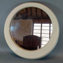 A circular ceramic framed wall mirror by Twyfords England, 52cms diameter