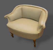 A Victorian small settee, the scroll padded back above a stuff over seat raised upon gilded scroll