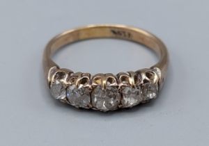 An 15ct gold five stone Diamond ring, the five graduated stones within a pierced setting, 3.8gms,