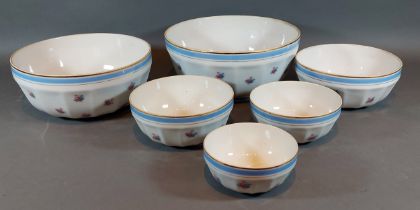 A set of six French porcelain graduated bowls, 23cms diameter to 10cms diameter