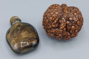 A Chinese carved walnut decorated with 100 faces, together a glass scent bottle