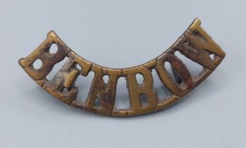 A WWI Benbow brass shoulder title