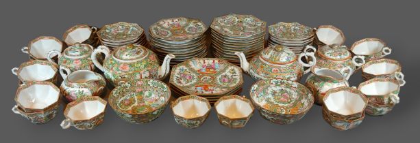 A Canton Tea service comprising cups and saucers, plates, teapot, sucrier and cream jug