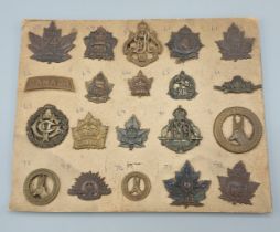 A collection of twenty WWI Canadian cap badges