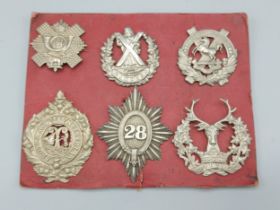 A set of six WWI Scottish cap badges