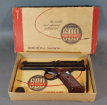 A Crosman 600 semi-automatic gas powered air pistol in original box